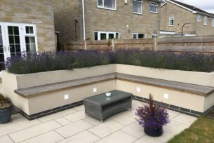  L-shaped garden seating built in storage and planting.