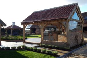  oak built garden structure with an outdoor kitchen using natural materials