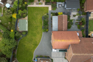  Aerial view of a modern garden design using clean lines, lawn, paving and planting.
