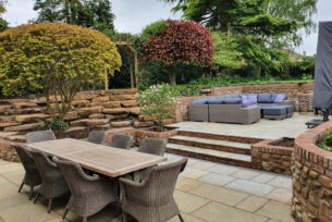  Garden design creating split levels using natural materials.