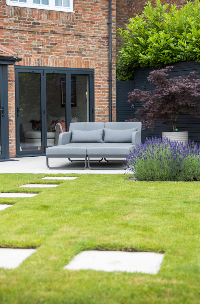 Contemporary small garden using porcelain paving and lavender planting